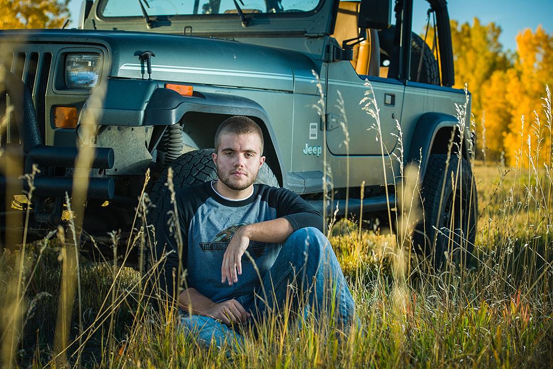 Erie high scool senior boy in erie co with Jeep on a fall day