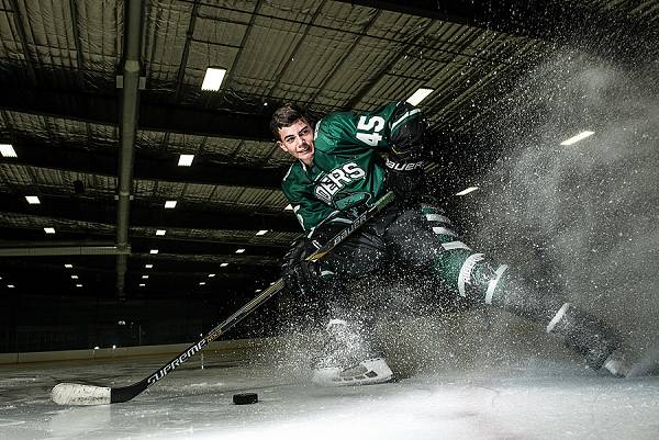 hockey player spraying ice