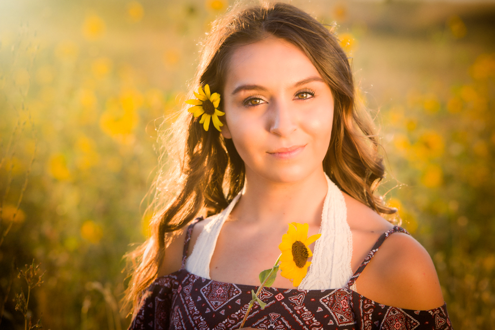 Senior girl in sunflower field