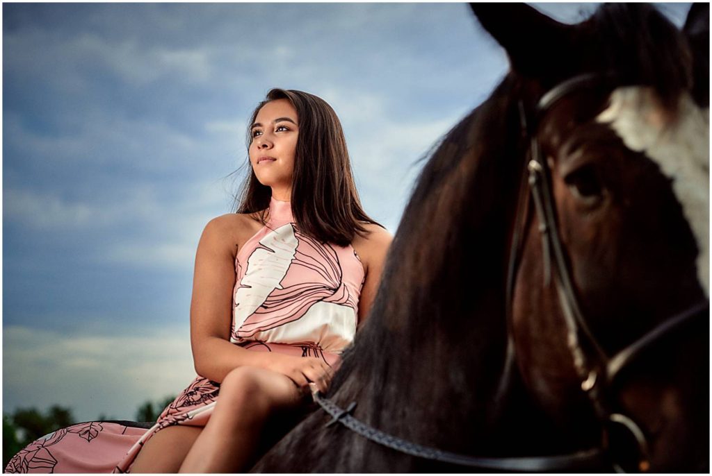 Senior girl sitting on horse